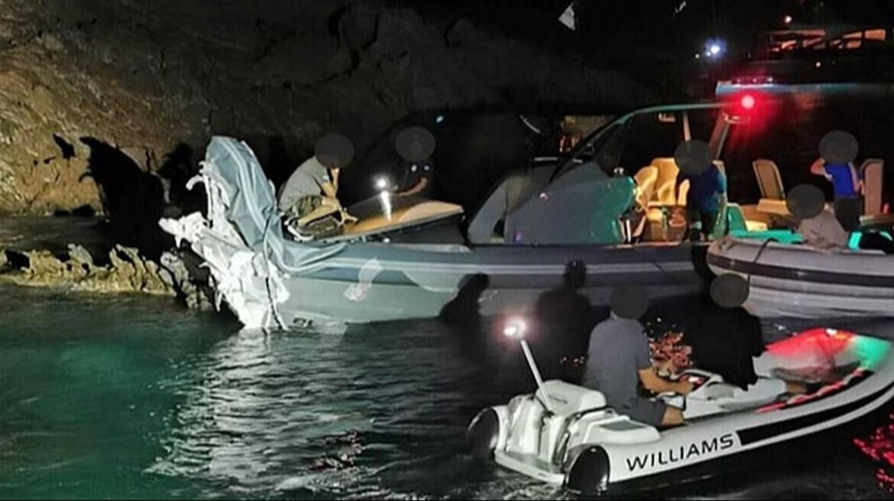 The inflatable boat involved in the accident is seen heavily damaged after hitting rocks near the island of Leros, Greece, 2023. (Photo via Onedio)