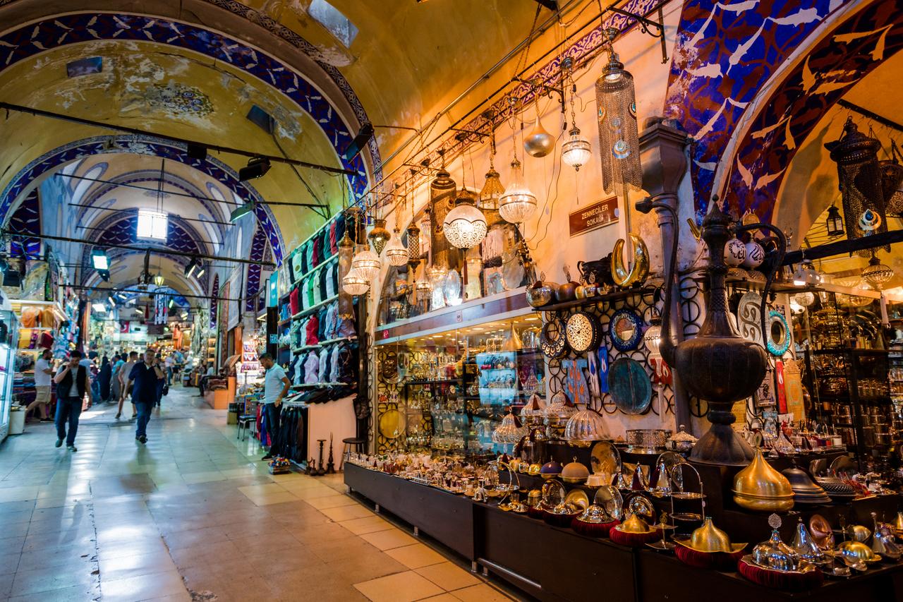 Shoppers walk through historic Grand Bazaar, one of the world’s largest and oldest covered markets in Istnabul, Türkiye, July 10, 2017. (Adobe Stock Photo)