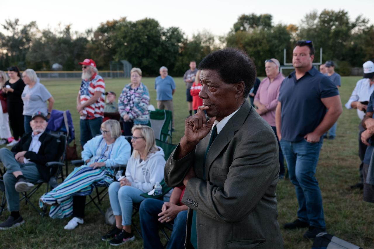 People attend a prayer vigil led by Pastor Fr. Georges Bidzogo outside Holy Redeemer Church in Burton, Michigan, on September 28, 2025. (AFP Photo)
