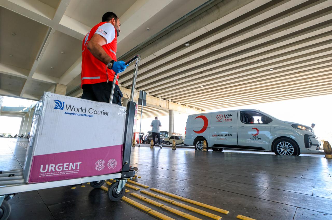 A Turkish Red Crescent worker is seen carrying a package. (Photo via Turkish Red Crescent)