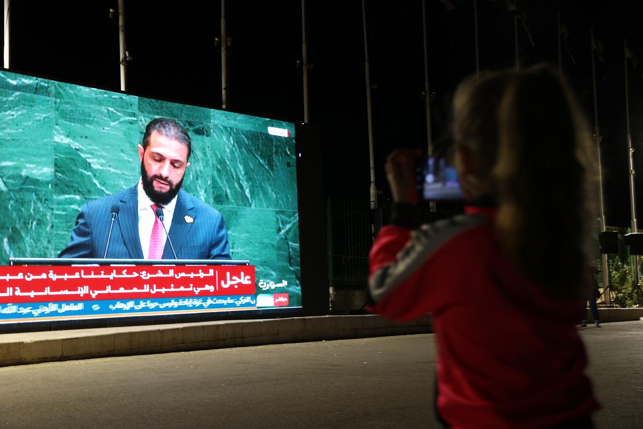 Syrian President Ahmed al-Sharaa is seen on a giant screen as people gather at the Umayyad Square to celebrate after Ahmed al-Sharaa's speech at the United Nations General Assembly, in Damascus, Syria, September 24, 2025. (AA Photo  )