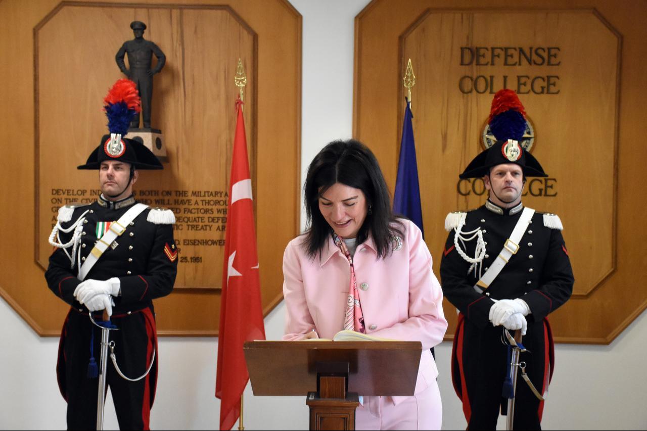 Türkiye's Ambassador to Rome, Elif Comoglu Ulgen signing the guest book as the guest of honor at the NATO Defense College's new term opening in Rome, Italy, September 2, 2025. (AA Photo)