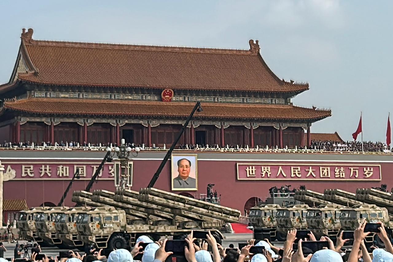 People take photos of rocket artillery units during a military parade in Beijing’s Tiananmen Square, September 3, 2025. (AFP Photo)