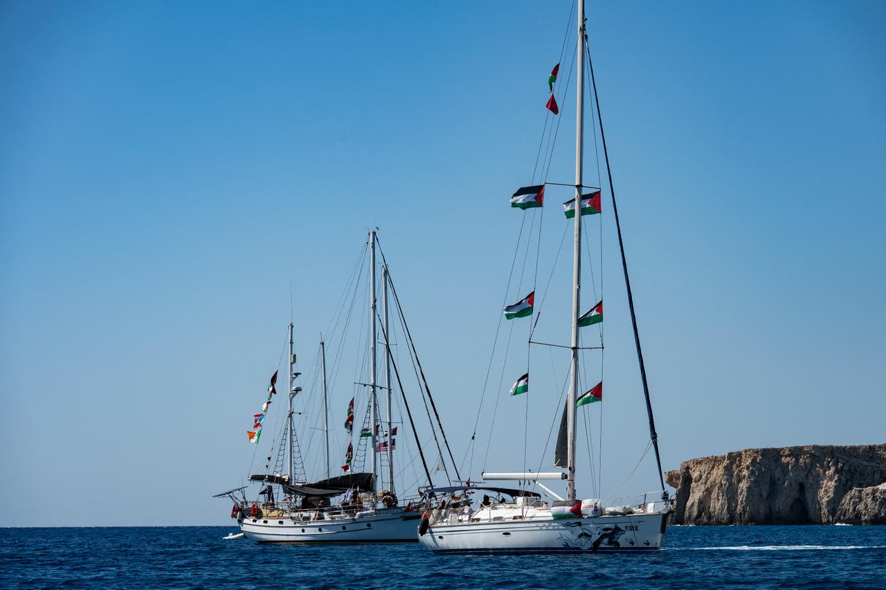 Members of the group of ships of the Global Sumud Flotilla to Gaza are seen moored at the small island of Koufonisi, south of the island of Crete, on September 26, 2025. (AFP Photo)