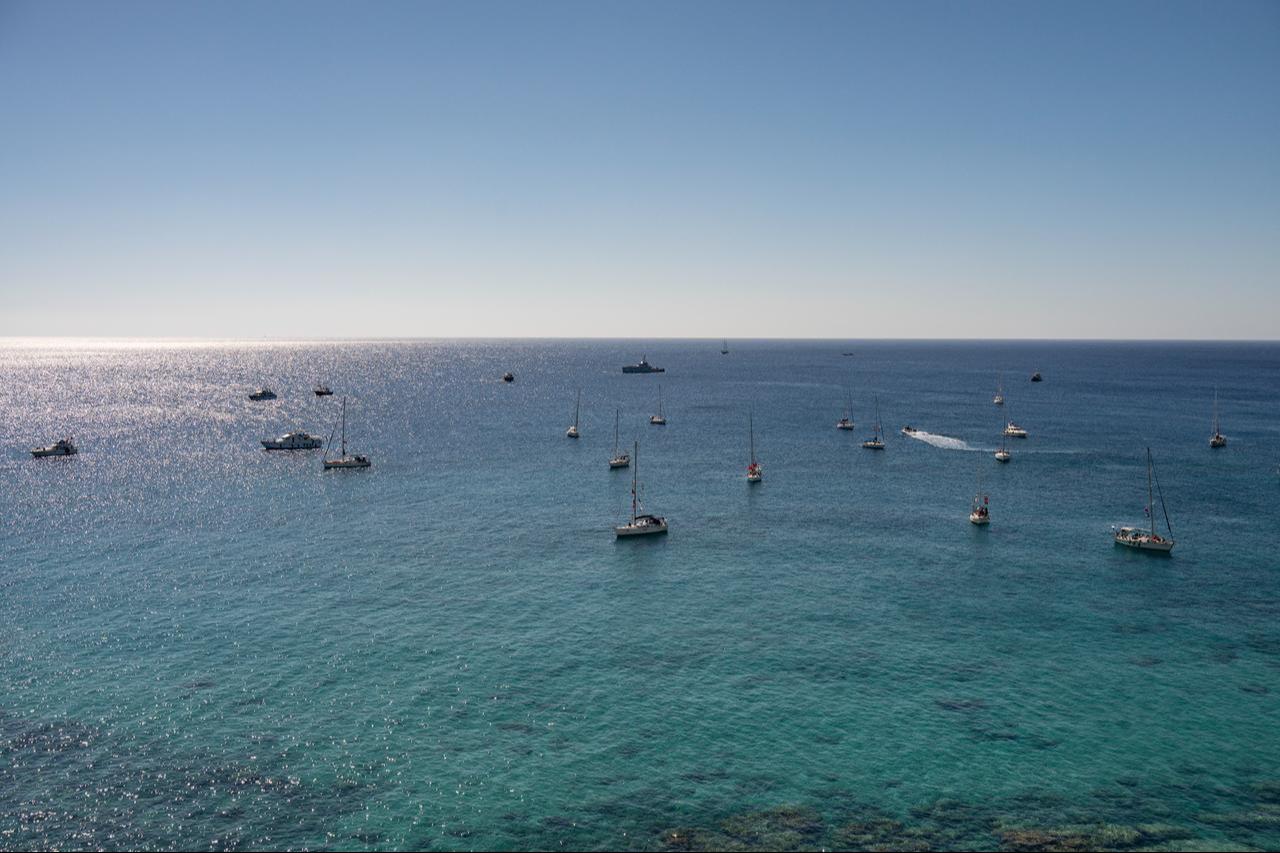 A group of ships of the Global Sumud Flotilla to Gaza are shown moored at the small island of Koufonisi, south of the island of Crete on September 26, 2025. (AFP Photo)