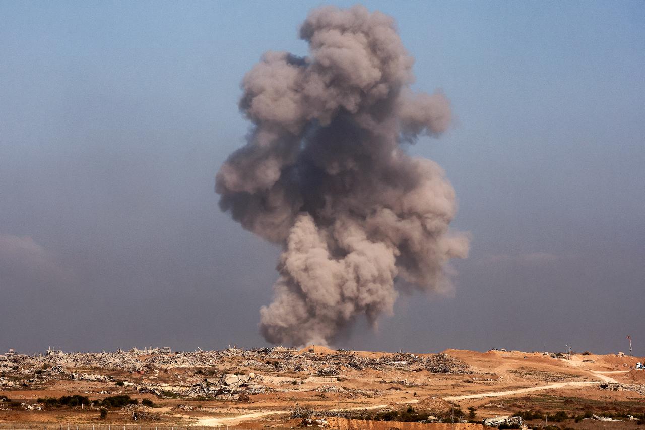 A smoke plume billows following Israeli bombardment on the Gaza Strip as pictured from a position across the border in southern Israel on Sept. 30, 2025. (AFP Photo)