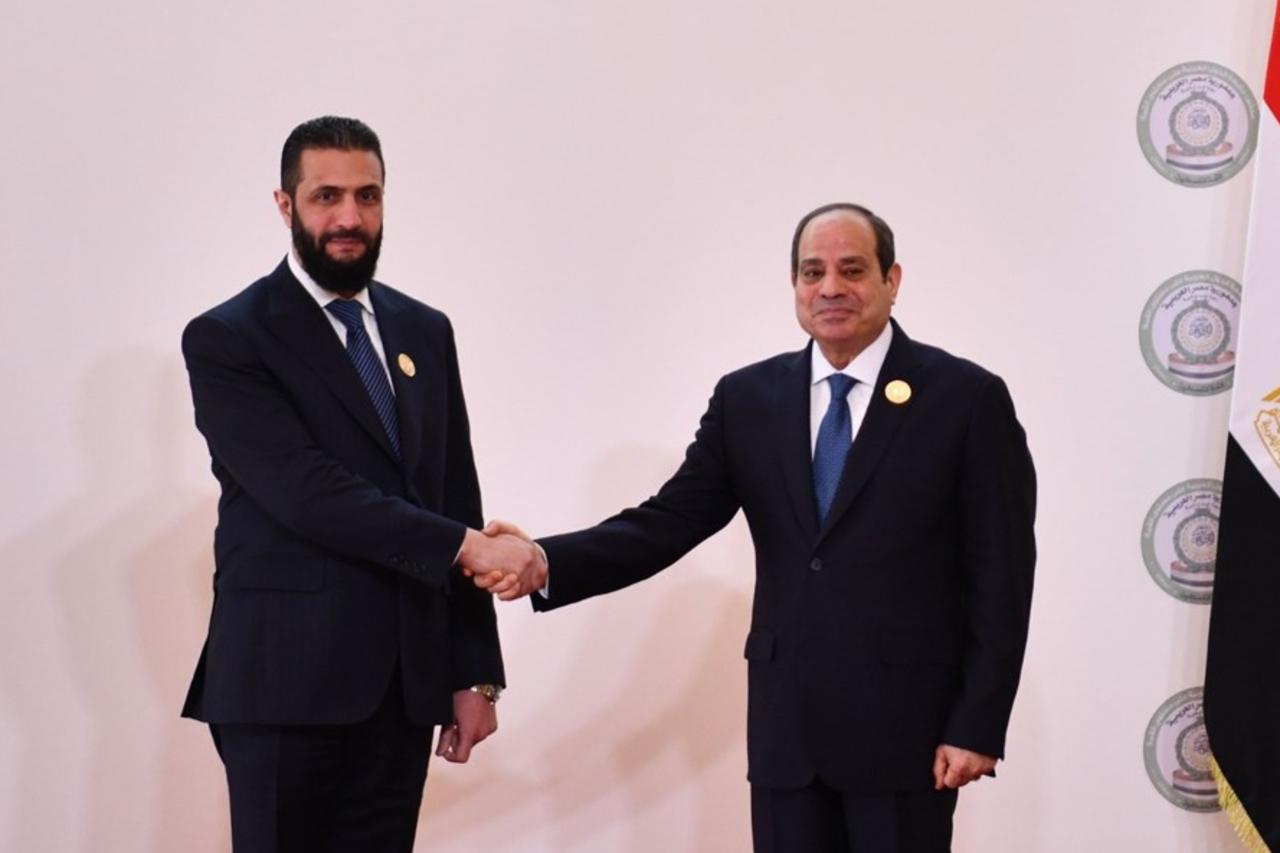 Egyptian President Abdel Fattah al-Sisi  welcomes Syrian President Ahmed al-Sharaa  for the emergency Arab summit in Cairo, Egypt , March 04, 2025. ( AA Photo )