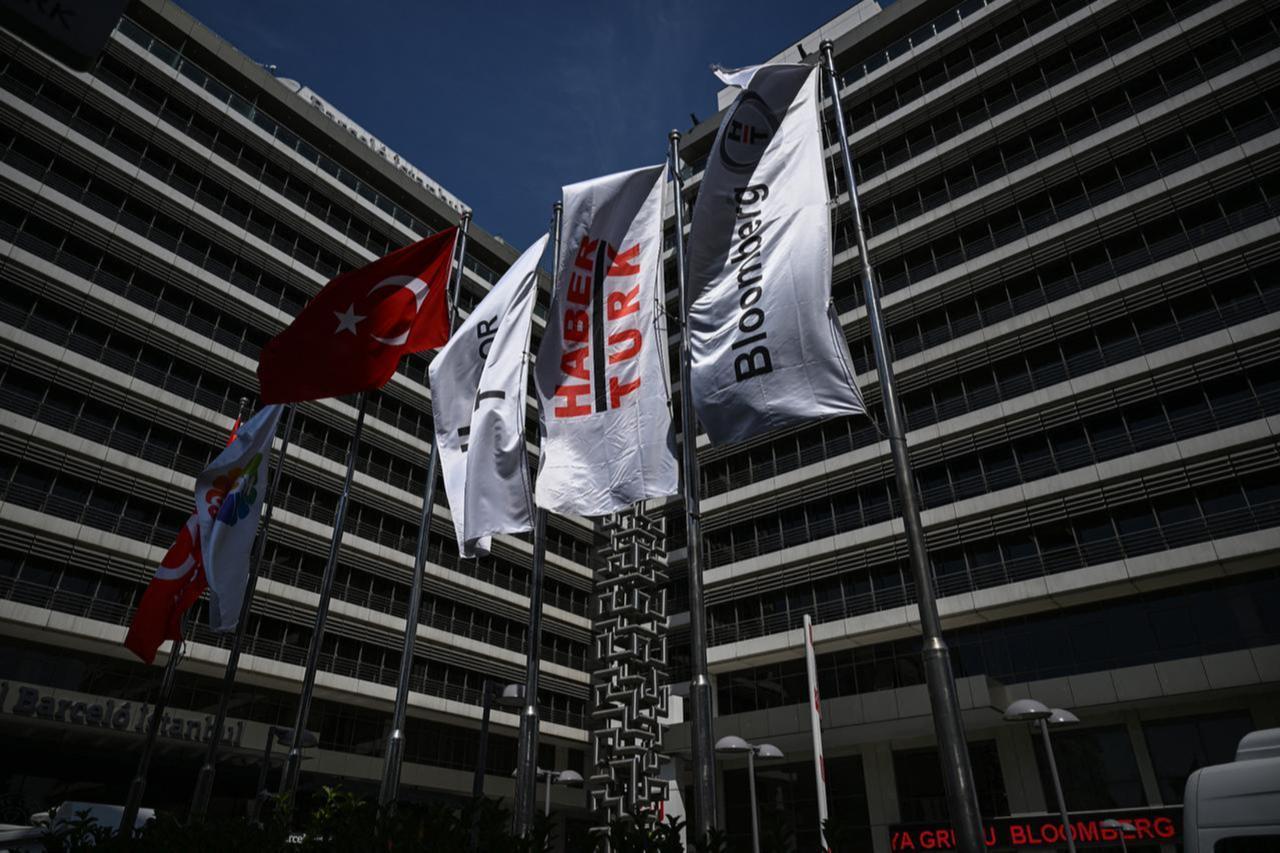 Flags of Haberturk and BloombergHT are seen outside Can Holdings Haberturk TV stations headquarters in Istanbul, September 11, 2025. (AFP Photo)