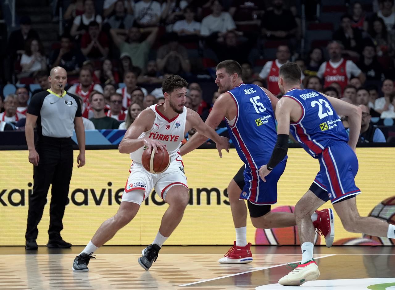 Türkiye's national basketball team faces Serbia in their fifth Group A match at Riga Arena, with Alperen Sengun (23) contesting a play against Serbia's Nikola Jokic (15) In EuroBasket 2025, Riga, Latvia, Sep. 3, 2025. (AA Photo)