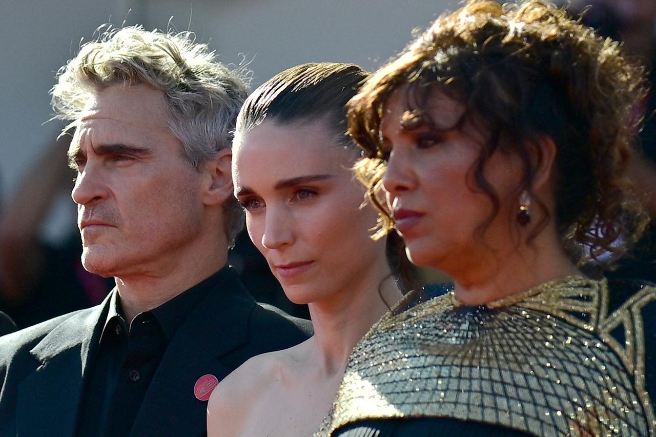 US actor Joaquin Phoenix, US actress Rooney Mara, and Tunisian director Kaouther Ben Hania attend the red carpet for the movie "The Voice of Hind Rajab" at Venice Lido on September 3, 2025. (AFP Photo)