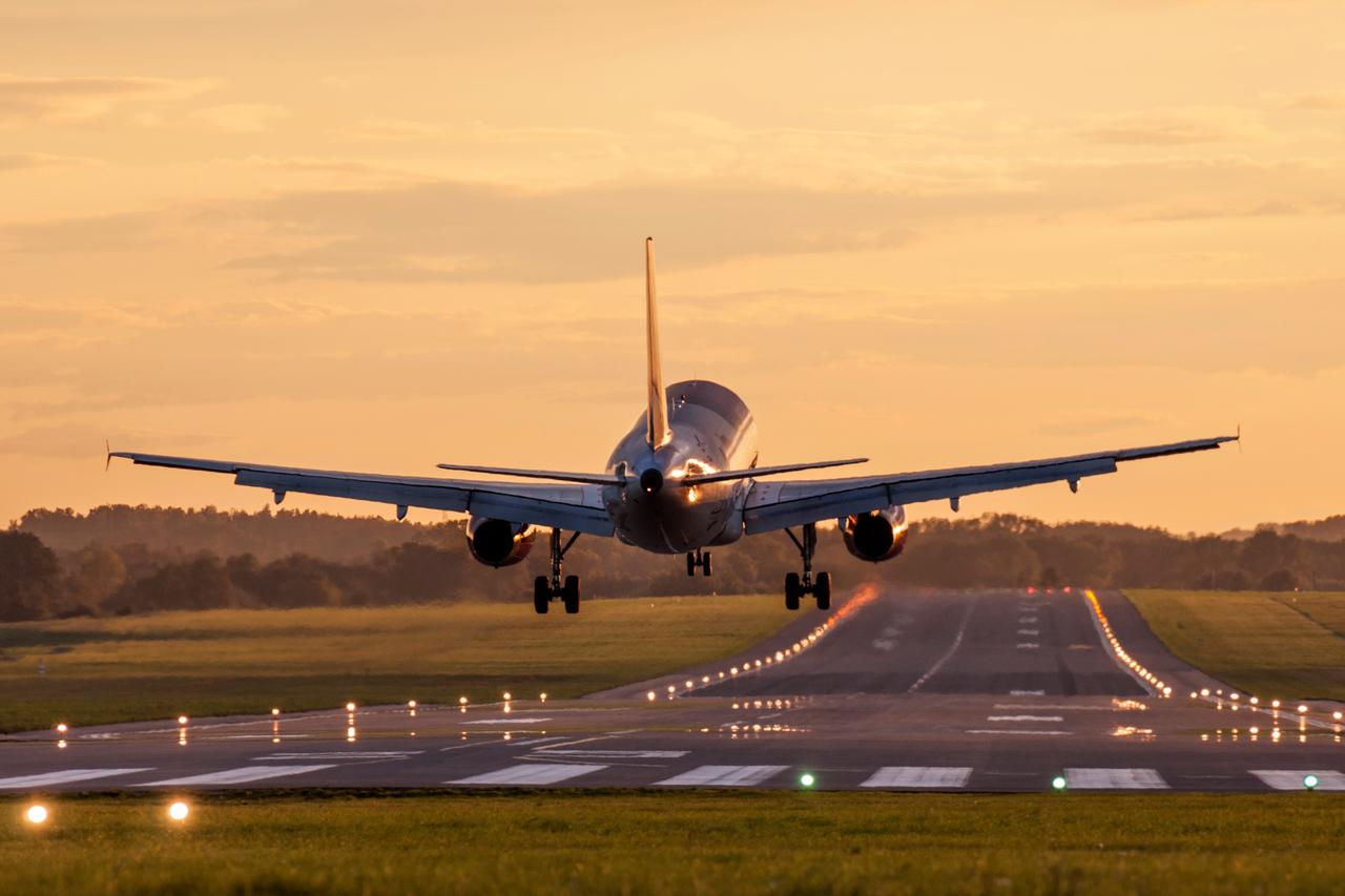 Passenger aircraft approaches the airport runway for landing. (Adobe Stock Photo)