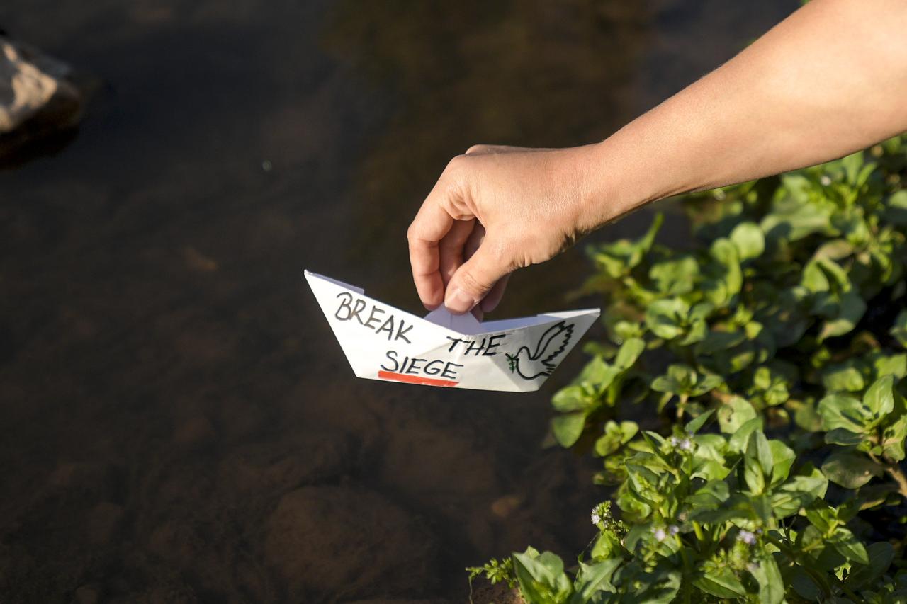 Bosnians float paper boats on Miljacka River to show solidarity with Global Sumud Flotilla that set sail to break the Israeli blockade on Gaza, Sarajevo, Bosnia and Herzegovina, September 4, 2025. (AA Photo)