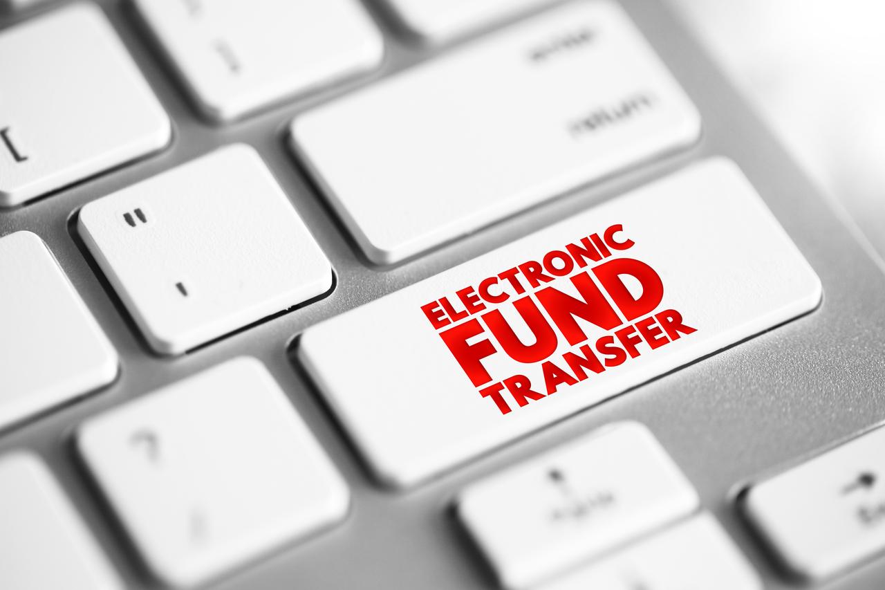 Electronic Fund Transfer is the electronic transfer of money from one bank account to another, illustrated with a text concept button on a keyboard, accessed on Sep. 5, 2025. (Adobe Stock Photo)