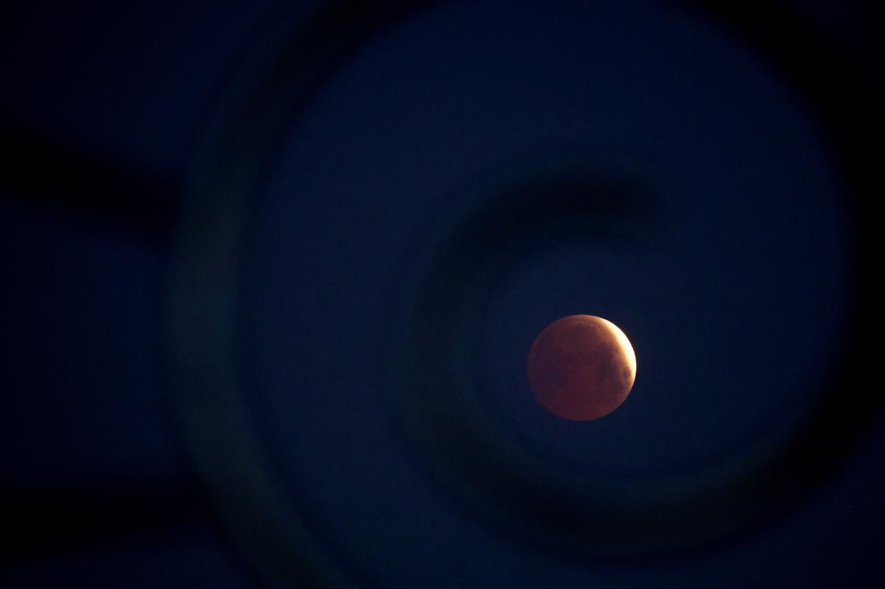 A rare  blood Moon  total lunar eclipse is captured near totality from the village of Donon, 40 km from Pontevedra, in northwestern Spain, early on March 14, 2025. (AFP File Photo)