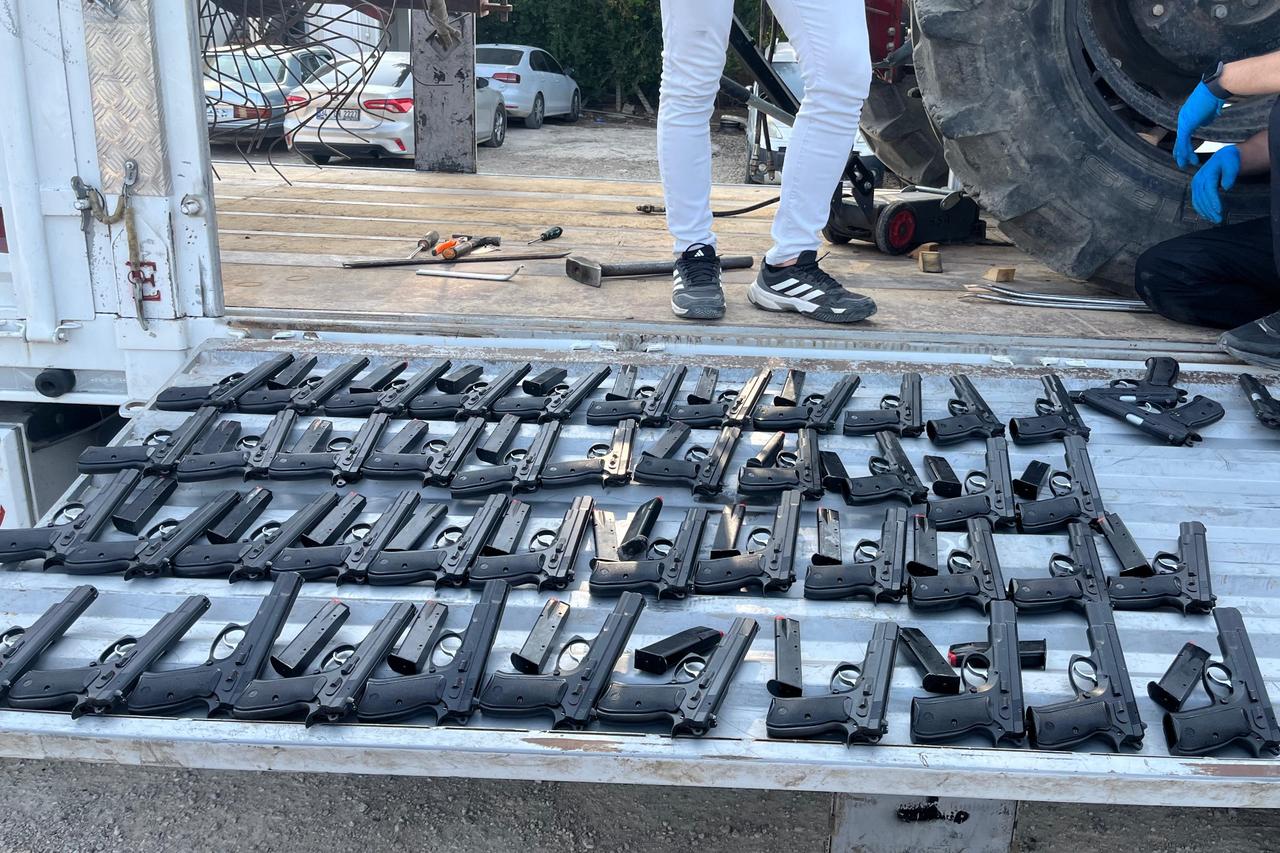 The weapons seized in an illegal arms operation in Adana, Türkiye, were confiscated by the police in August 2025. (AA Photo)