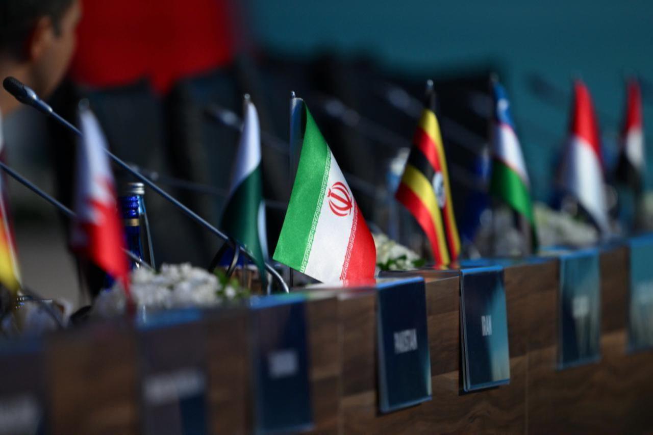 An Iranian flag with a general view of the 51st Meeting of the Council of Foreign Ministers of the Organization of Islamic Cooperation (OIC) in Istanbul, Türkiye, June 21, 2025. (AA Photo)