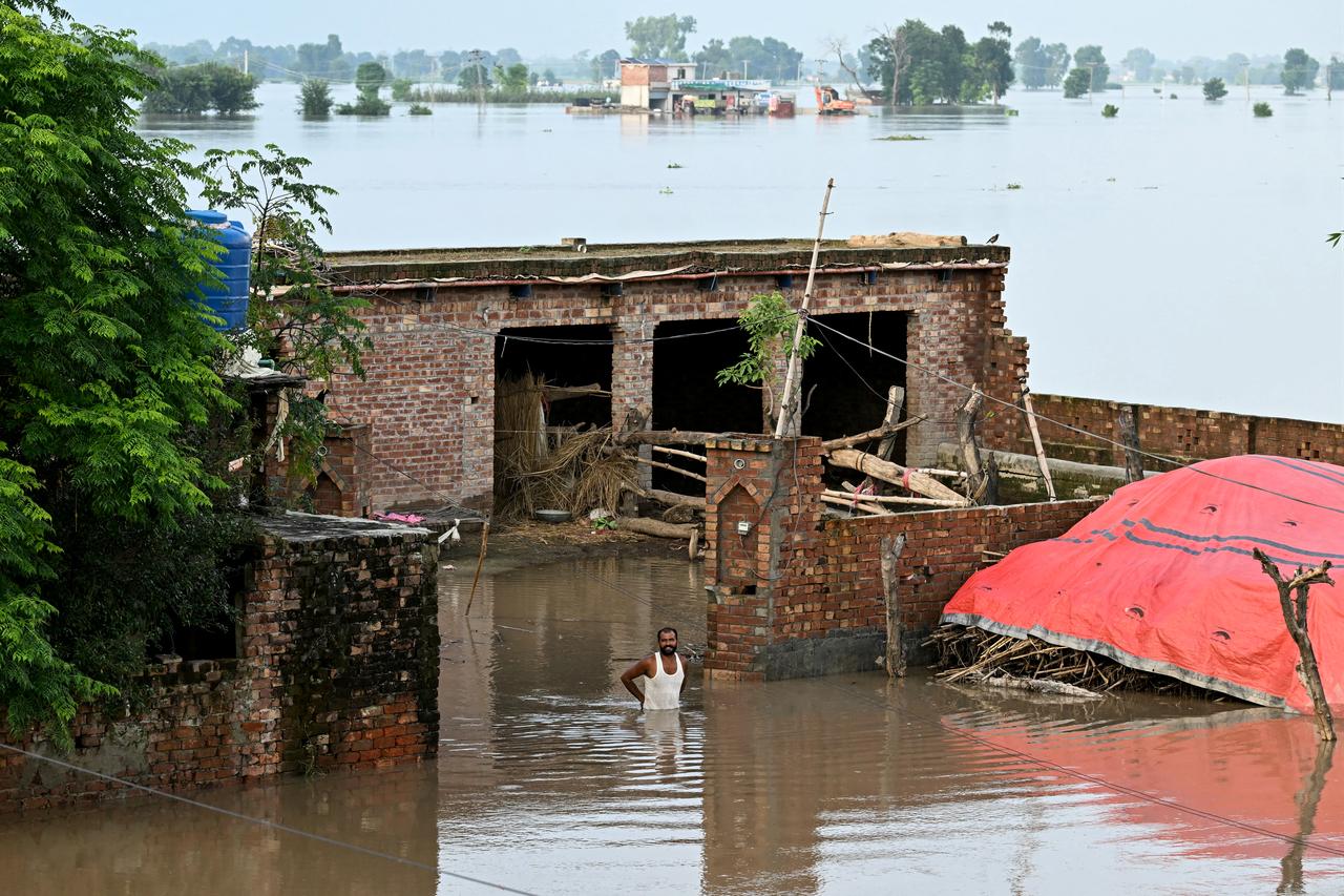 A villager stands outside his partially submerged home following heavy rains that caused the Sutlej River to rise in Kasur district, Punjab, Pakistan, September 3, 2025. (AFP Photo)