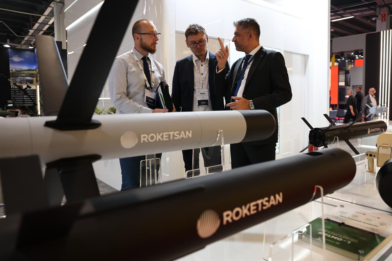 Visitors talk as Roketsan showcases missile systems at its stand during the 33rd International Defence Industry Exhibition (MSPO) in Kielce, Poland, September 2, 2025. (AA Photo)