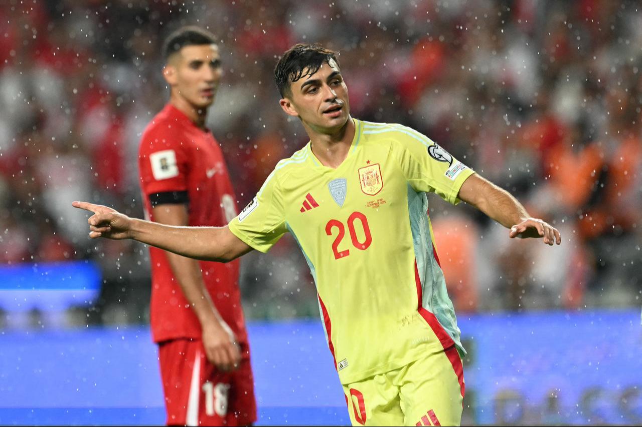 Spain's midfielder #20 Pedri (R) celebrates after scoring Spain's sixth goal during the FIFA World Cup 2026 Group E qualification football match between Türkiye and Spain, Konya, Türkiye, Sept. 7, 2025.