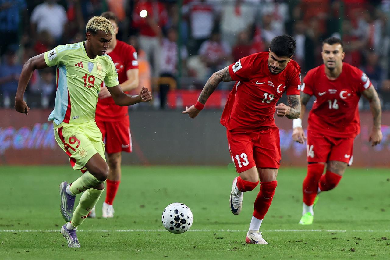 Eren Elmali (13) of Türkiye in action against Lamine Yamal (19) of Spain during the 2026 FIFA World Cup European Qualifiers Group E second match between Türkiye and Spain, Konya, Türkiye, Sepy. 7, 2025. (AA Photo)