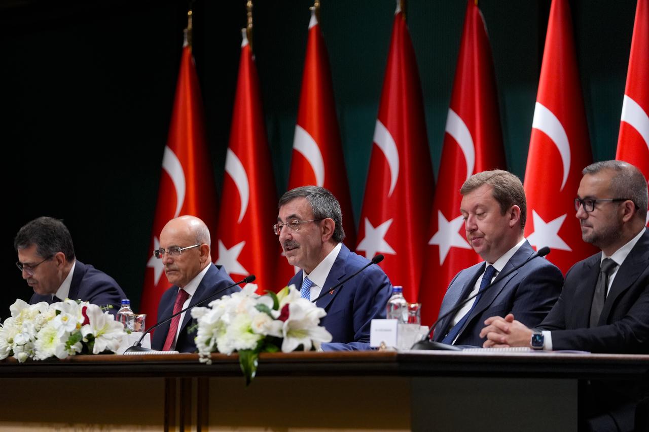 Vice President Cevdet Yilmaz, flanked by Treasury and Finance Minister Mehmet Simsek, Central Bank Governor Fatih Karahan, and other officials, presents Türkiye’s Medium-Term Program for 2026–2028 at the Presidential Complex in Ankara, September 8, 2025. (AA Photo)