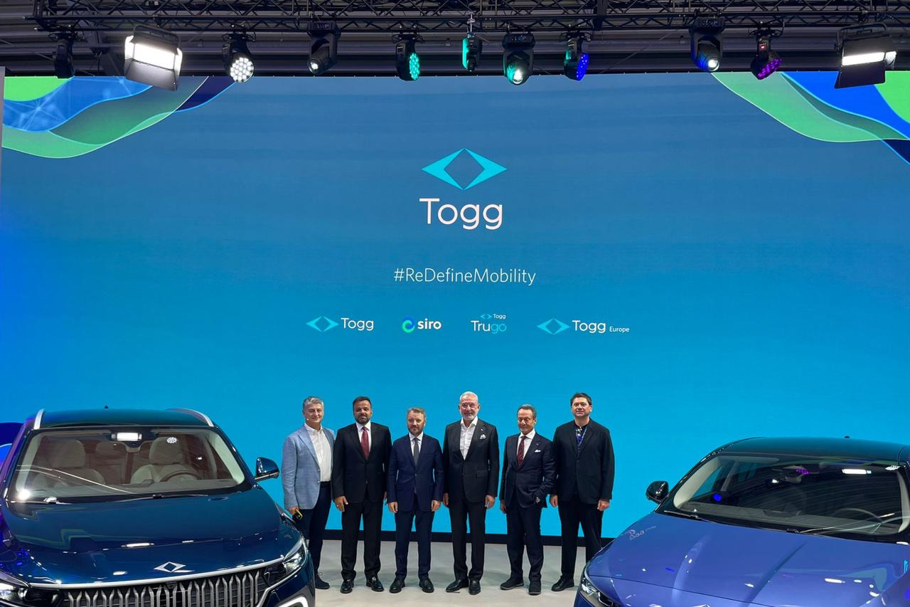 Togg executives stand alongside the T10X and newly unveiled T10F models at the IAA Mobility 2025 exhibition in Munich, Germany, Sept. 8, 2025. (Photo via turkiyegazetesi.com.tr)