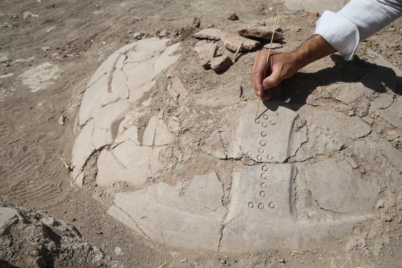 Archaeological excavations at a fortress ruin on the slopes of Mount Erek in Van’s Ipekyolu district, Türkiye, have uncovered 76 cuneiform-inscribed pithos (large storage jars) used during the Urartian period to preserve oil, grain, and beverages, Sept. 7, 2025. (AA Photo)