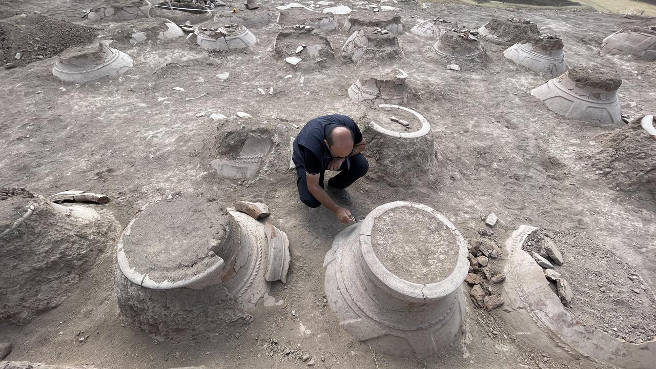 Archaeological excavations at a fortress ruin on the slopes of Mount Erek in Van’s Ipekyolu district, Türkiye, have uncovered 76 cuneiform-inscribed pithos (large storage jars) used during the Urartian period to preserve oil, grain, and beverages, Sept. 7, 2025. (AA Photo)