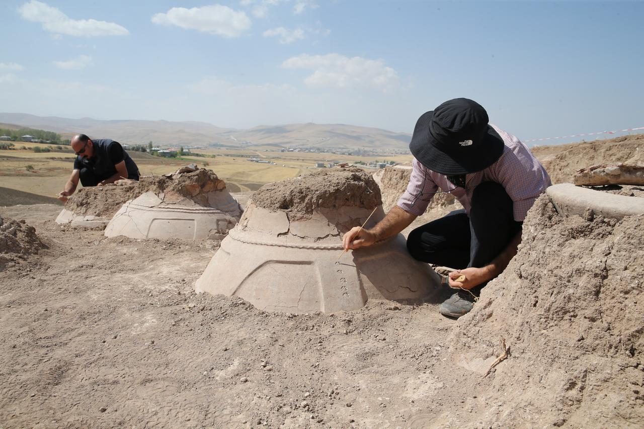 Archaeological excavations at a fortress ruin on the slopes of Mount Erek in Van’s Ipekyolu district, Türkiye, have uncovered 76 cuneiform-inscribed pithos (large storage jars) used during the Urartian period to preserve oil, grain, and beverages, Sept. 7, 2025. (AA Photo)