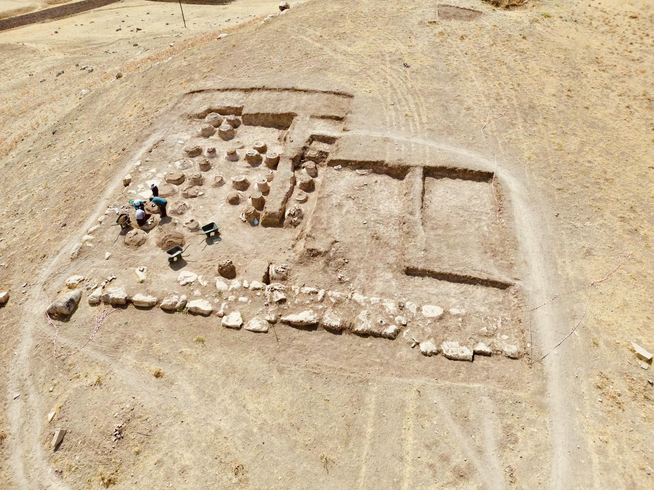 Archaeological excavations at a fortress ruin on the slopes of Mount Erek in Van’s Ipekyolu district, Türkiye, have uncovered 76 cuneiform-inscribed pithos (large storage jars) used during the Urartian period to preserve oil, grain, and beverages, Sept. 7, 2025. (AA Photo)