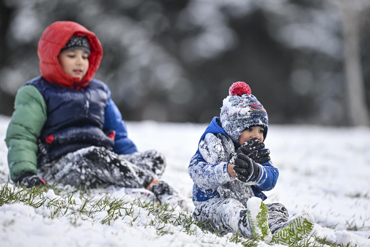 Children are seen at Segmenler Park after snowfall in Ankara, Türkiye on Jan. 1, 2026. (AA Photo)