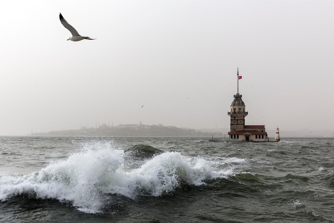 Waves crash near the Maiden’s Tower in Istanbul, Türkiye. (Adobe Stock Photo)