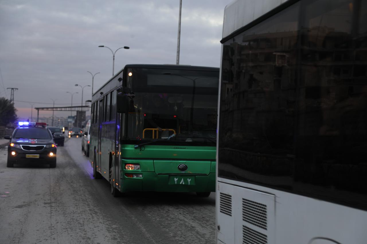 Buses carrying YPG/SDF members depart Sheikh Maqsoud neighborhood under an evacuation agreement following army operations in Aleppo, Syria, Jan. 10, 2026. (AA Photo)