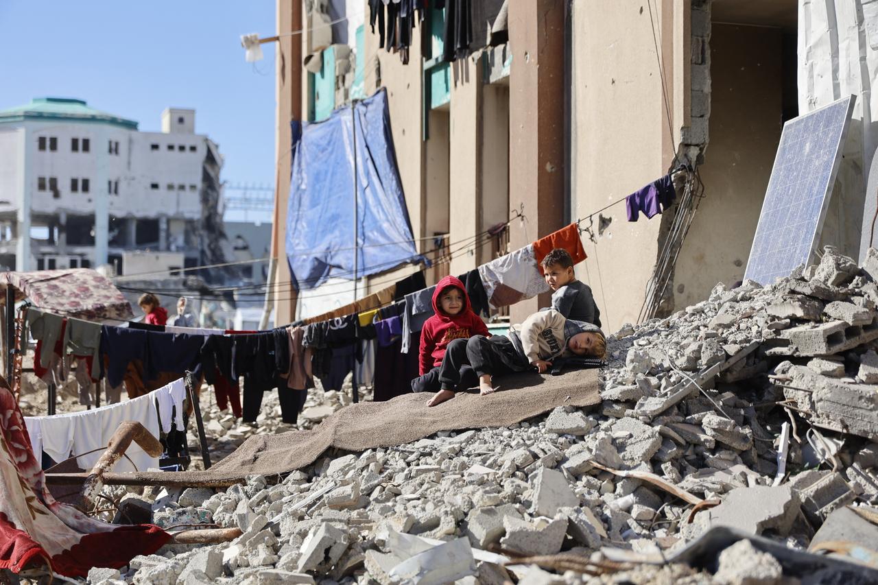 Laundry hangs on lines strung across the rubble of destroyed buildings where displaced Palestinian families set-up their home shelters, in Gaza City on Jan. 11, 2026. (AFP Photo)