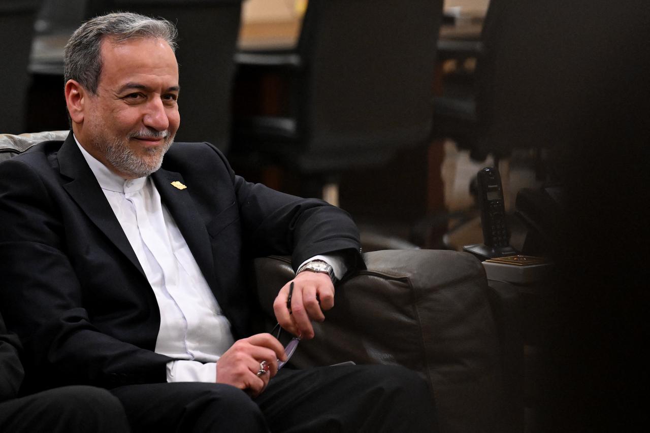 Iranian Foreign Minister Abbas Araghchi sits for a meeting with Lebanon's Prime Minister Nawaf Salam at the government palace in Beirut on January 9, 2026. (AFP Photo)