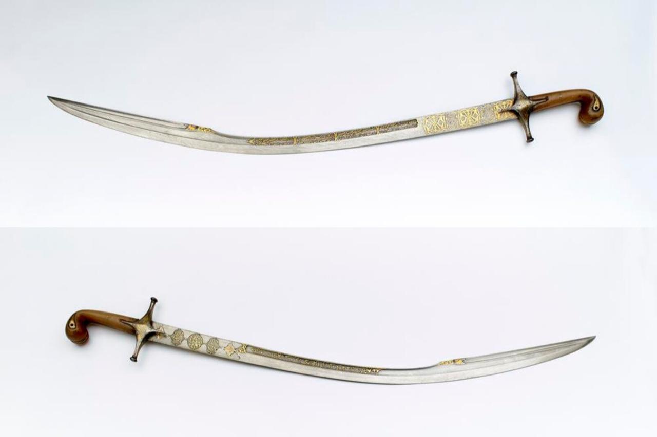 Kilij or sword, a sabre with an inscription of Ottoman Sultan Selim III. Made of gold-inlaid horn and metal from Türkiye. (Photo via the British Museum)