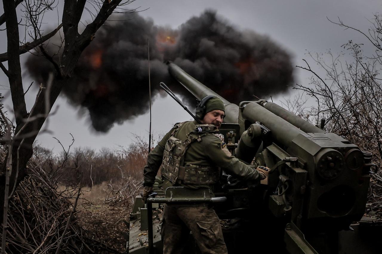 A Ukrainian serviceman of the 24th Mechanized Brigade fires a 2s5 152 mm self-propelled howitzer towards Russian positions at an undisclosed location near Chasiv Yar in Donetsk region on November 18, 2024, amid the Russian invasion of Ukraine. (AFP Photo)