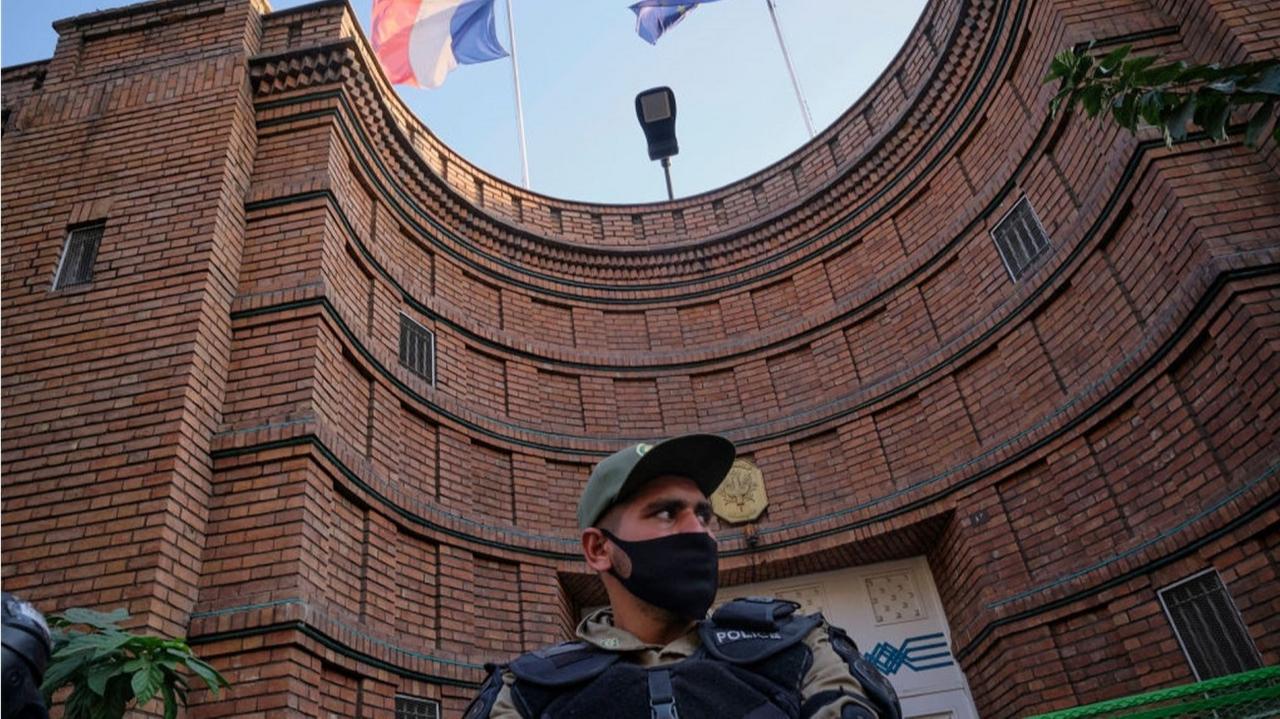 A police officer stands guard outside the French Embassy in Tehran, Iran. (AFP Photo)