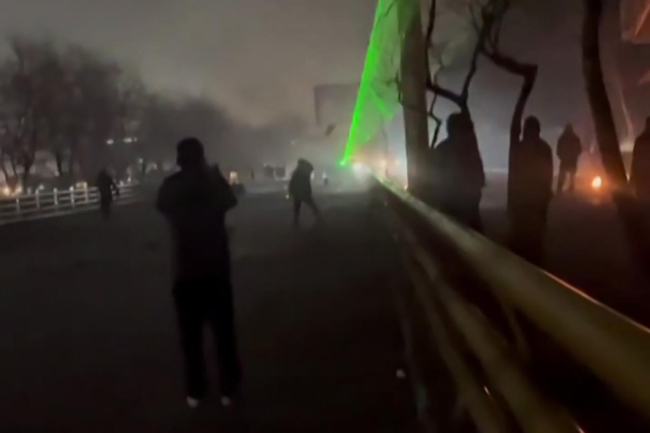 This video grab taken on January 13, 2026 from UGC images posted on social media on January 10, 2026 shows clashes in Mashhad, in northeastern Iran. (Photo by UGC/AFP)