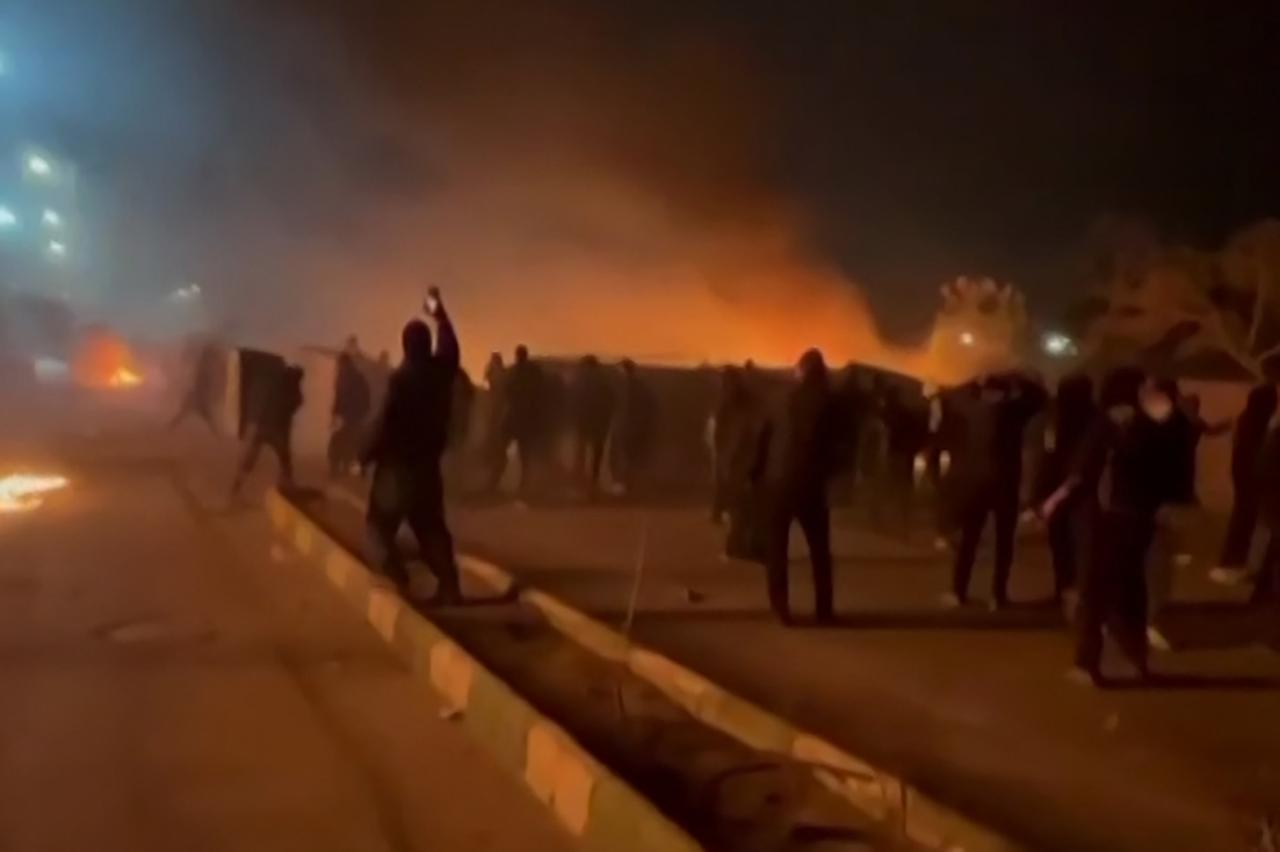 This video grab taken on January 13, 2026 from UGC images posted on social media on January 10, 2026 shows clashes in Mashhad, in northeastern Iran. (Photo by UGC/AFP)