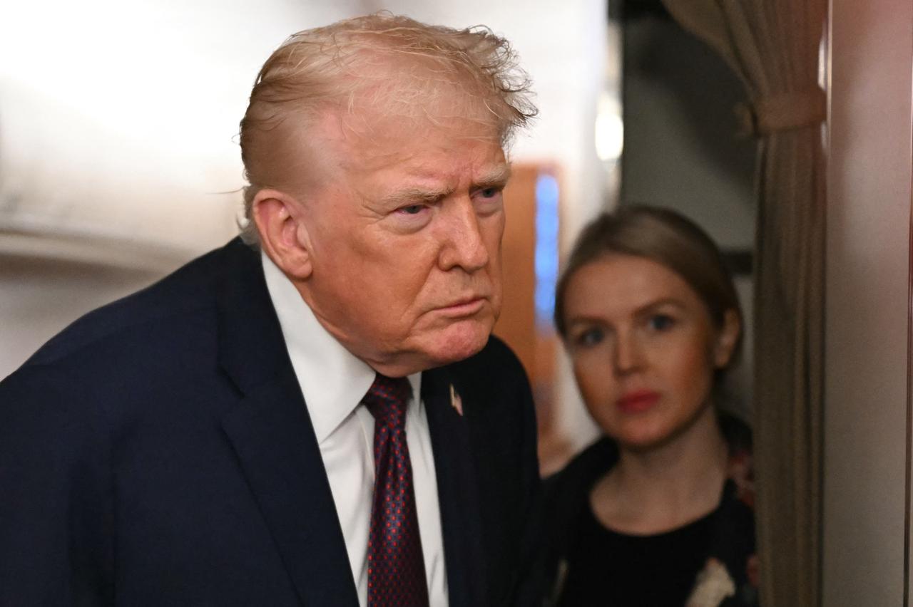 US President Donald Trump speaks to the press aboard Air Force One on January 11, 2026. (AFP Photo)