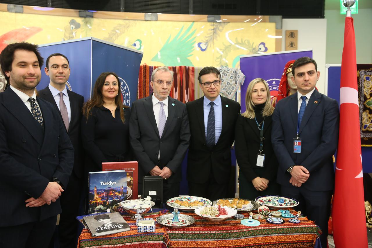 Diplomatic representatives pose at a stand presenting traditional Turkish cuisine and cultural items during Turkish Week at the United Nations Vienna Office, Vienna, Austria, Jan. 12, 2026. (AA Photo)