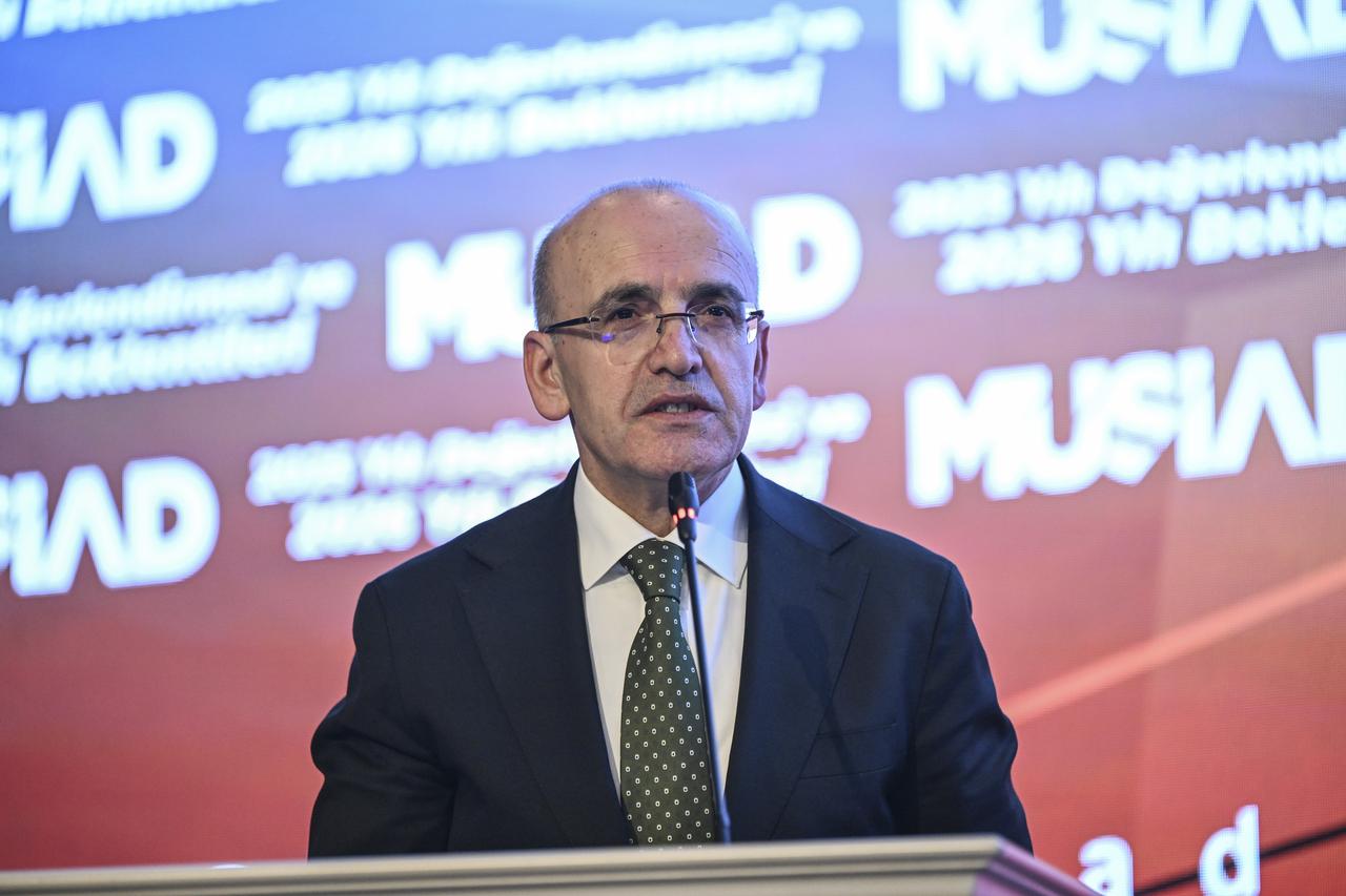 Turkish Treasury and Finance Minister Mehmet Simsek speaking at the Independent Industrialists and Businessmen Association's (MUSIAD) program. (AA Photo)