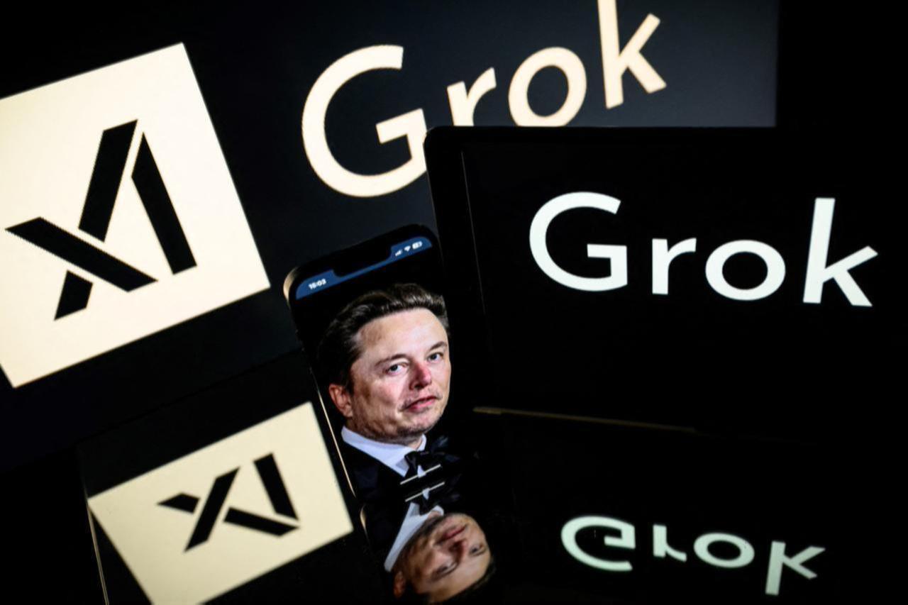 This photo illustration taken on January 13, 2025 in Toulouse shows screens displaying the logos of xAI and Grok, a generative artificial intelligence chatbot developed by xAI, accessed on March 29, 2025. (AFP Photo)