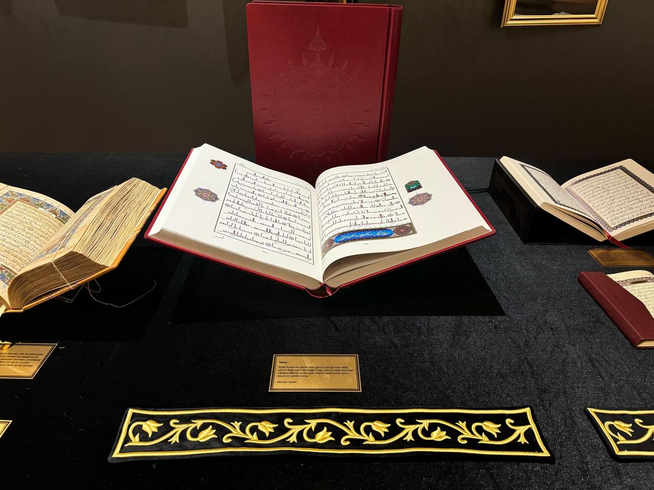 A decorated Quran manuscript is presented open at a selected surah during the “Golden Letters” exhibition in Istanbul, Türkiye, Jan.15, 2026. (AA Photo)