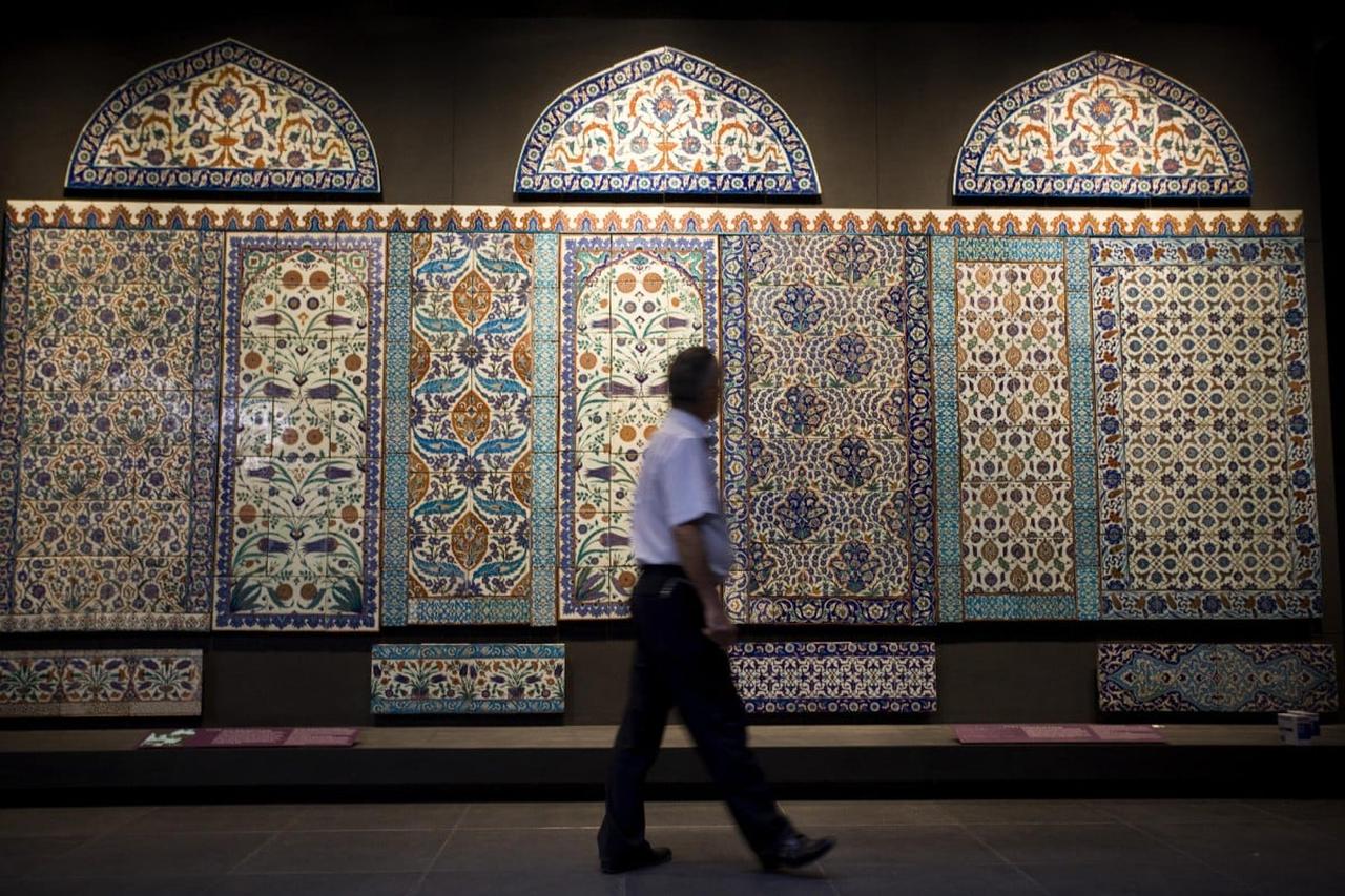 Intricately patterned Ottoman ceramic tiles from the 16th and 17th centuries on display at the Louvre Museum in Paris, France. (Photo via The New York Times)