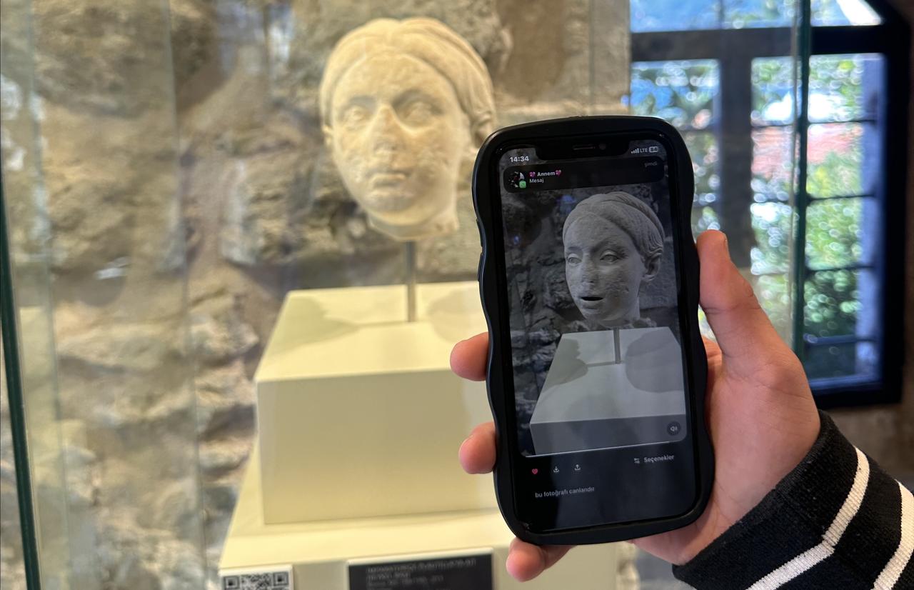 A student uses a smartphone application to digitally animate an ancient marble head on display at the Marmaris Castle Museum as part of an artificial intelligence project in Mugla, Türkiye, Jan. 15, 2026. (AA Photo)