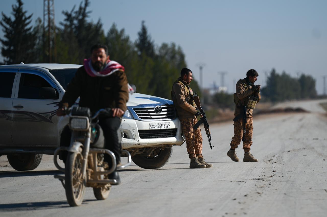 Syrian security forces continue to maintain security measures at a checkpoint in the Hamimah area, approximately 5 kilometers from Deir Hafir after receiving information that SDF were preventing civilians from evacuating the area in Deir Hafer, Aleppo, Syria on Jan. 15, 2026. (AA Photo)