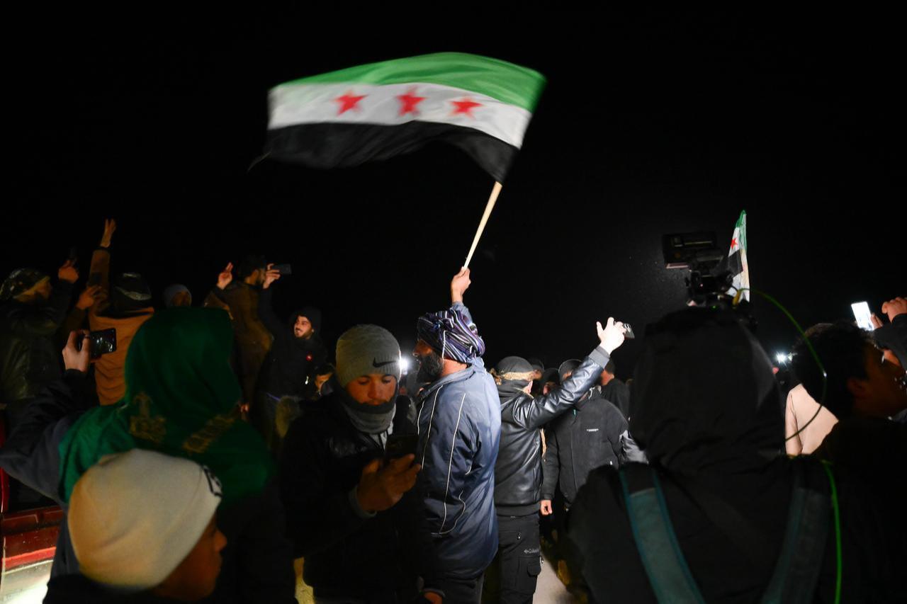 Civilians celebrate in the Humeyme village of the Dayr Hafir district, east of Aleppo, Syria, on January 17, 2026. (AA Photo)