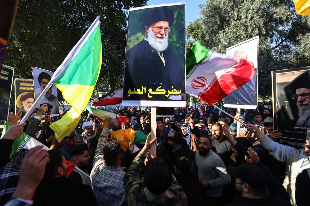 Protesters hold up a portrait of Iran's Supreme Leader Ayatollah Ali Khamenei during a demonstration near the Iranian embassy in Baghdad, Iraq on Jan. 16, 2026. (AFP Photo)